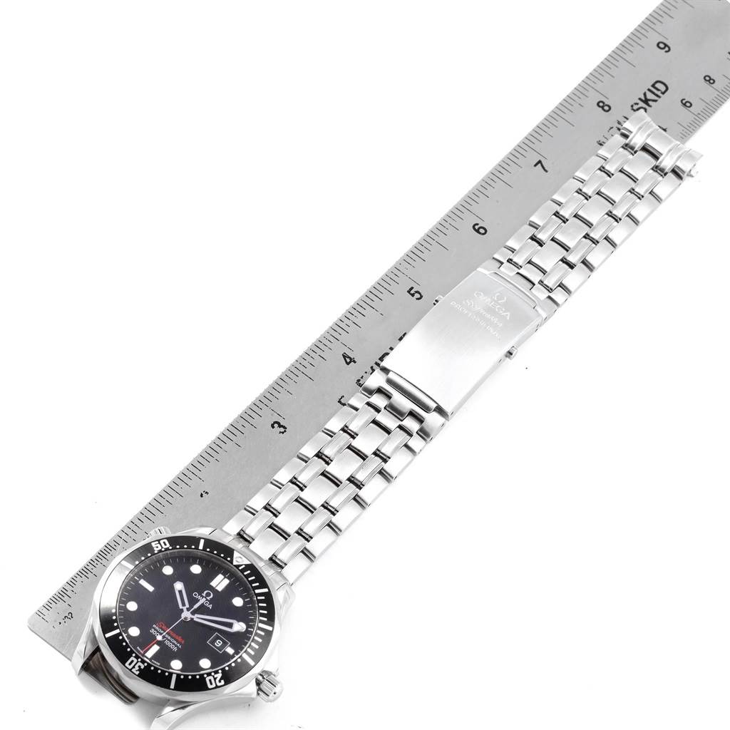 The Omega Seamaster 212.30.41.61.01.001 Men
s Stainless Steel Black Dial 212.30.41.61.01.001 Men
s Stainless Steel Black Dial watch is shown flat and vertically aligned next to a ruler, displaying its face and metal bracelet.