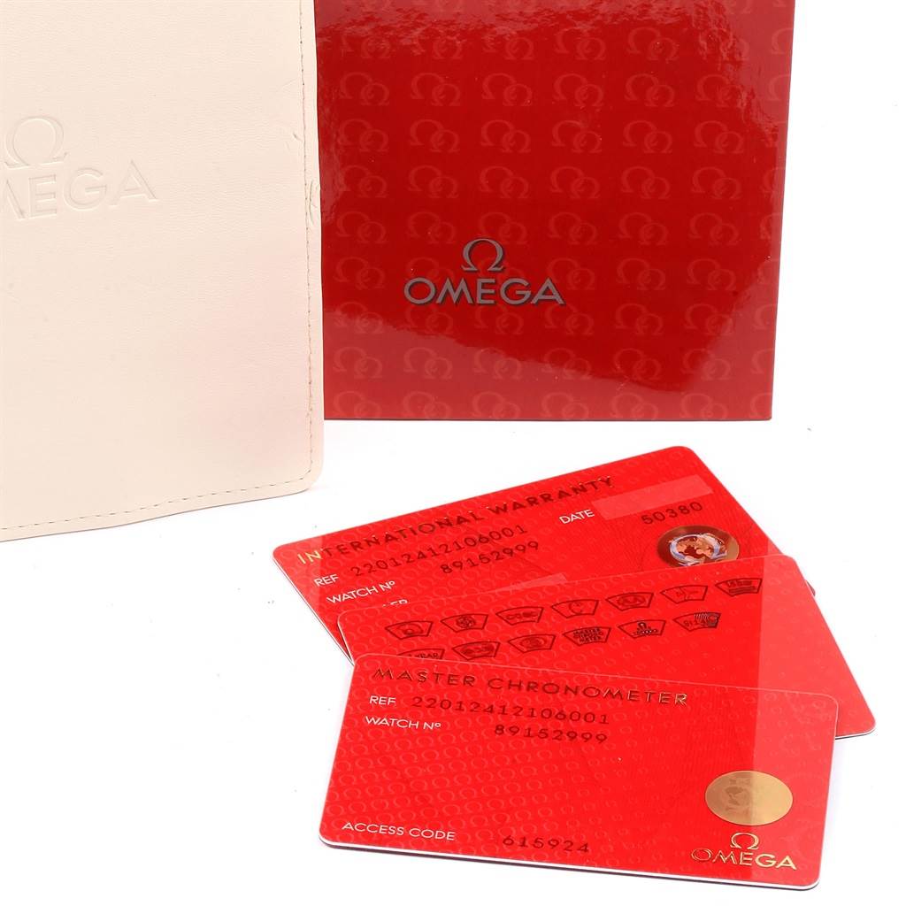 The image shows the warranty cards and packaging for an Omega Seamaster 220.12.41.21.06.001 Men
s Stainless Steel Grey Dial 220.12.41.21.06.001 Men
s Stainless Steel Grey Dial watch.