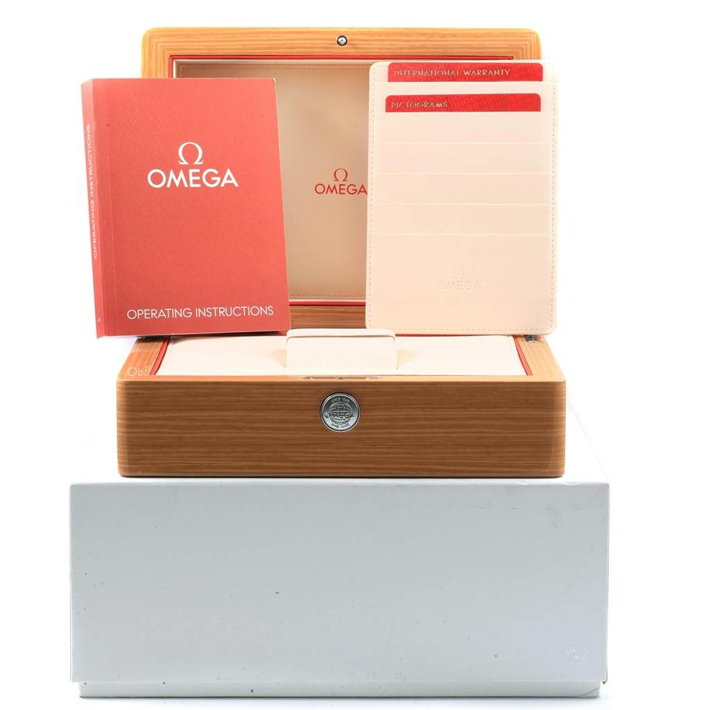The image shows the watch box of an Omega Seamaster 212.30.44.50.03.001 Men
s Stainless Steel Blue Dial 212.30.44.50.03.001 Men
s Stainless Steel Blue Dial, along with operating instructions and warranty cards.