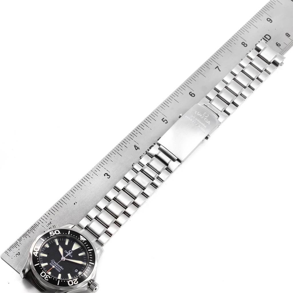 The image shows an Omega Seamaster 2262.50.00 Men
s Stainless Steel Black Dial 2262.50.00 Men
s Stainless Steel Black Dial watch laid flat with its metal bracelet extended alongside a ruler for measurement.