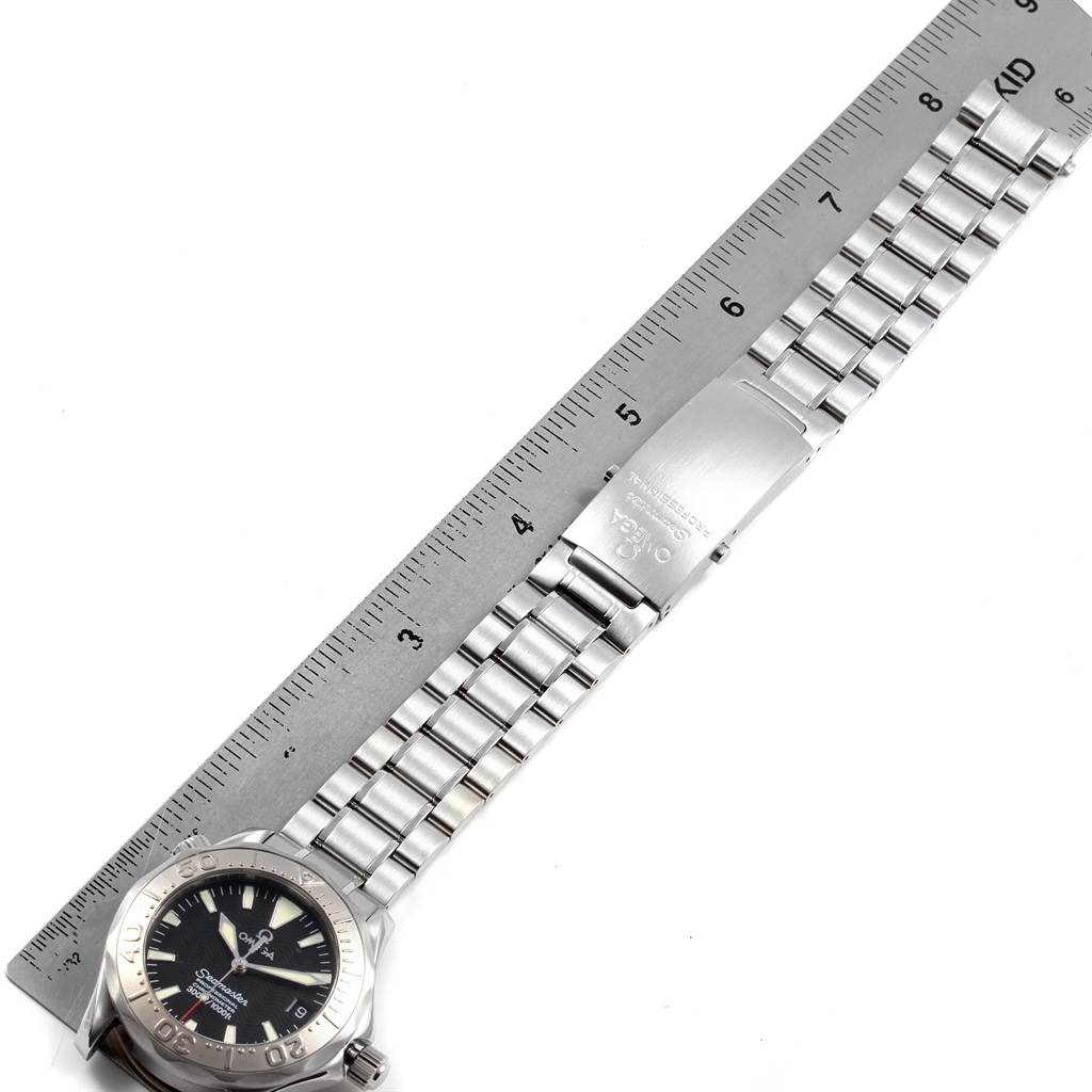 The image shows an Omega Seamaster 2236.50.00 Men
s Stainless Steel Black Dial 2236.50.00 Men
s Stainless Steel Black Dial watch laid flat alongside a ruler, displaying the watch face, bezel, and metal bracelet.