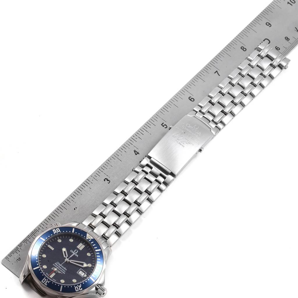 The image shows an Omega Seamaster 2537.80.00 Stainless Steel Blue Dial 2537.80.00 Stainless Steel Blue Dial watch laid flat, highlighting its bracelet, clasp, and face alongside a ruler for scale.