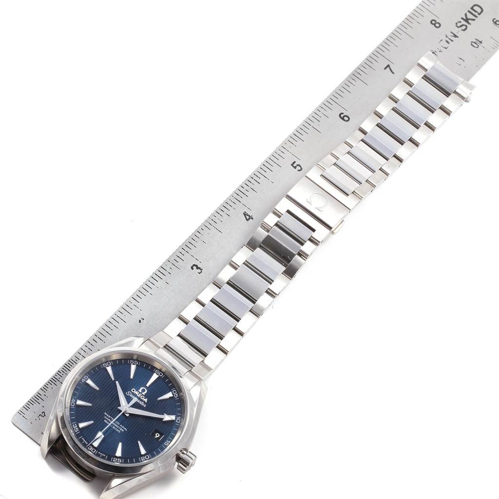 The image shows an Omega Seamaster 231.10.42.21.03.003 Men
s Stainless Steel Blue Dial 231.10.42.21.03.003 Men
s Stainless Steel Blue Dial watch with a blue dial and a metal bracelet, placed next to a ruler for scale.