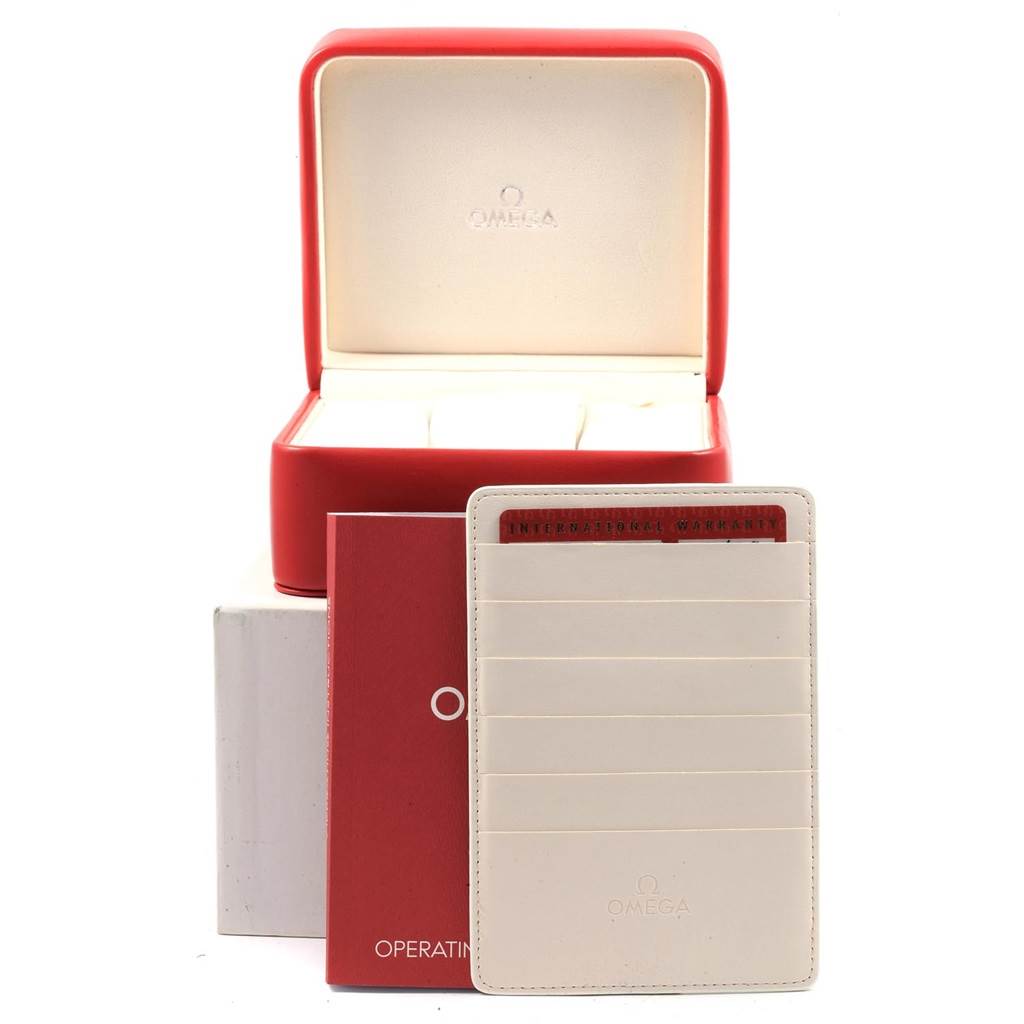 This image shows an open Omega Seamaster 231.10.42.21.03.003 Men
s Stainless Steel Blue Dial 231.10.42.21.03.003 Men
s Stainless Steel Blue Dial watch box, along with the operating instructions booklet and warranty card holder.