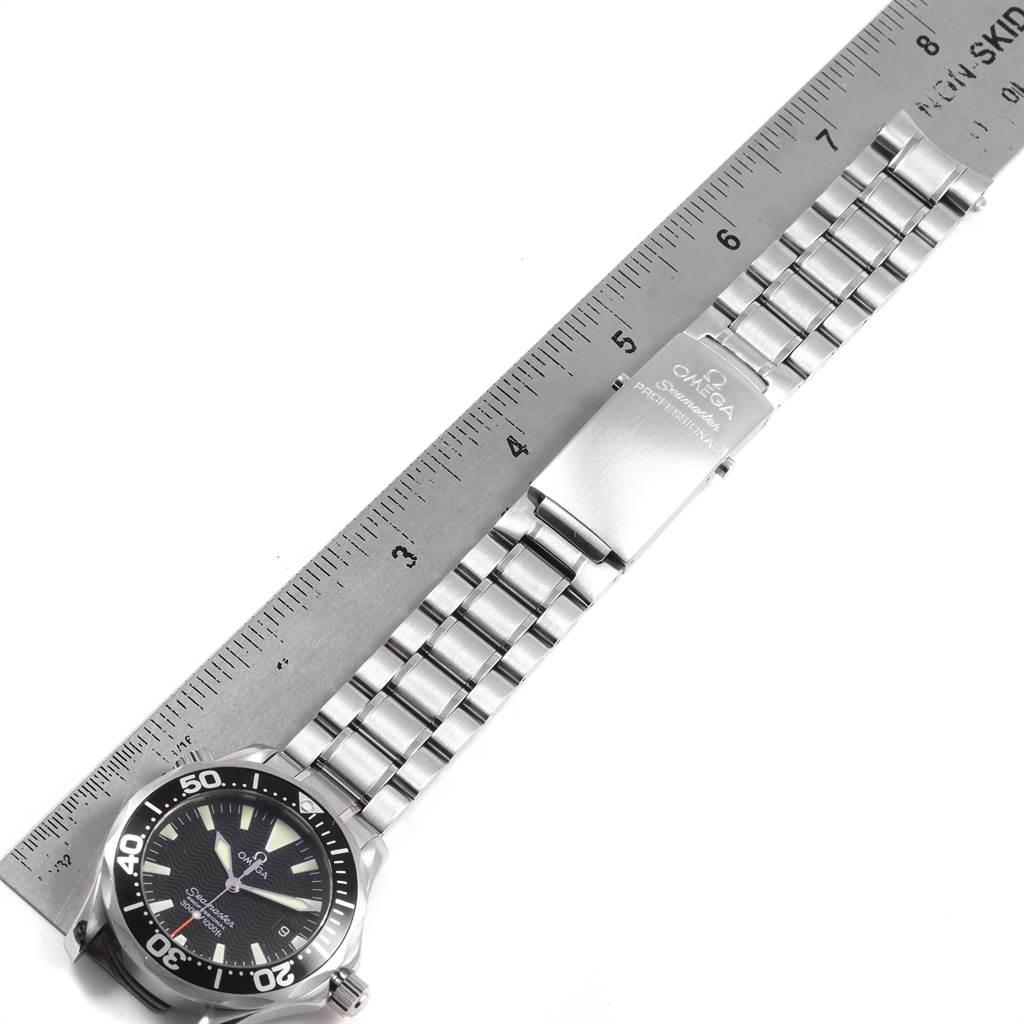 The image shows the Omega Seamaster 2262.50.00 Men
s Stainless Steel Black Dial 2262.50.00 Men
s Stainless Steel Black Dial watch laid flat with the full length of the bracelet and clasp, alongside a ruler for size reference.