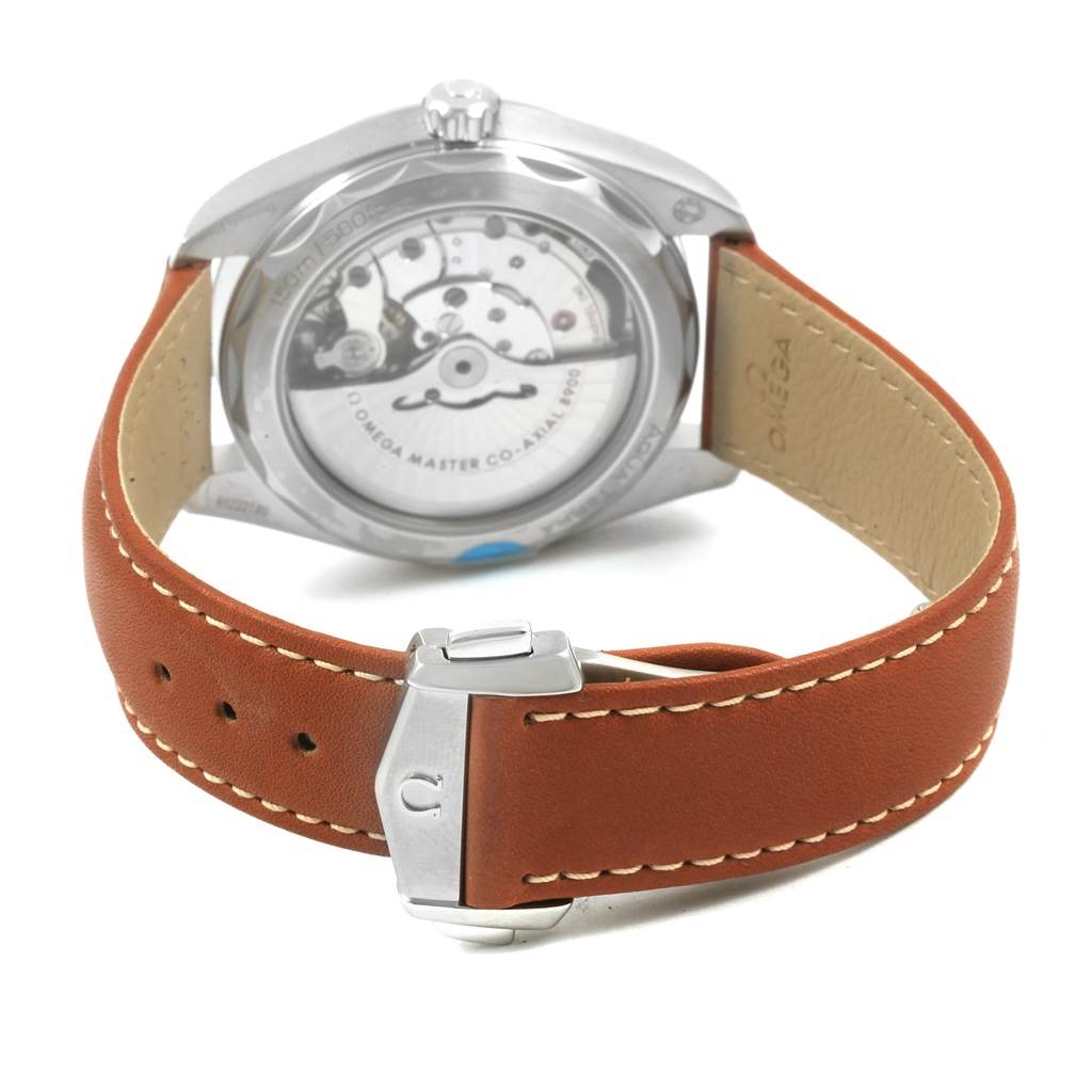 The image shows the back view of an Omega Seamaster 220.12.41.21.02.001 Men
s Stainless Steel Silver Dial 220.12.41.21.02.001 Men
s Stainless Steel Silver Dial watch and its brown leather strap with deployment clasp.