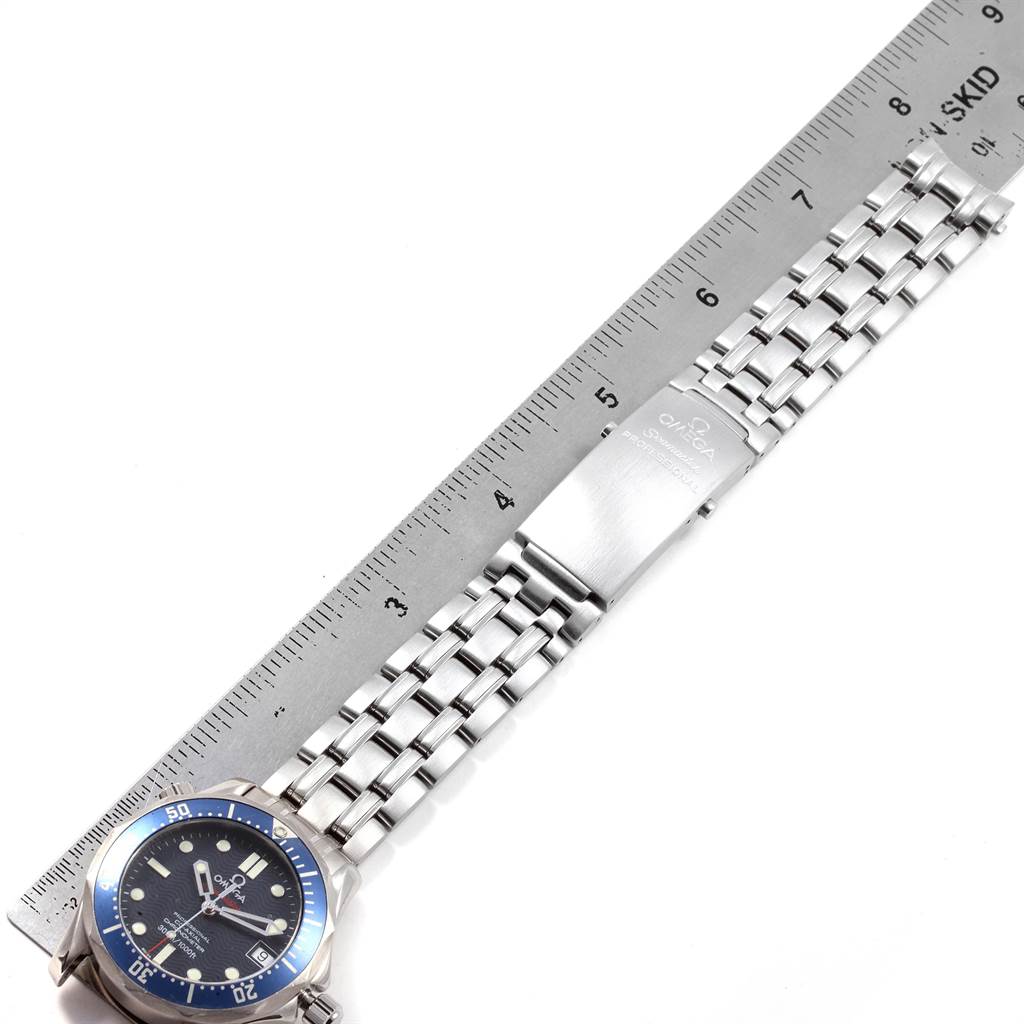 The image shows the Omega Seamaster 2222.80.00 Men
s Stainless Steel Blue Dial 2222.80.00 Men
s Stainless Steel Blue Dial watch from a top-down view, featuring its bezel, bracelet, and clasp alongside a ruler for scale.