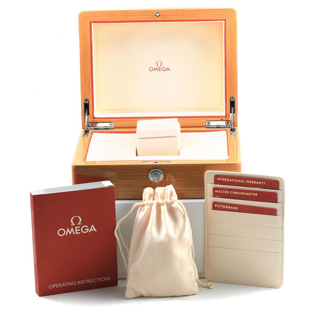 The image shows accessories for the Omega Seamaster 210.20.42.20.01.001 Men's Steel and Gold (two tone) Black Dial 210.20.42.20.01.001 Men's Steel and Gold (two tone) Black Dial watch: a wooden box, instruction manual, warranty cards, and a cloth pouch.