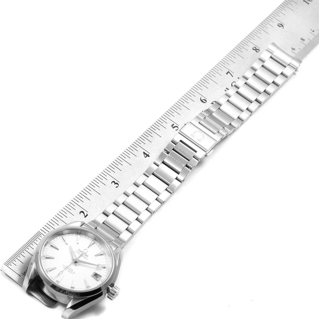 The Omega Seamaster 231.10.39.21.02.001 Men
s Stainless Steel Silver Dial 231.10.39.21.02.001 Men
s Stainless Steel Silver Dial watch is shown laying flat with a ruler measuring its bracelet length.