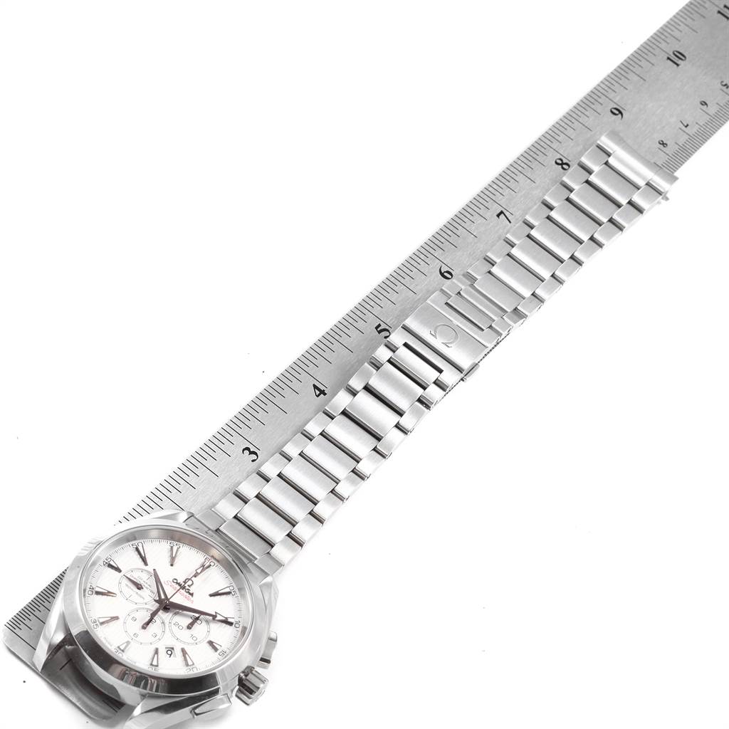 The Omega Seamaster 231.10.44.50.04.001 Men's Stainless Steel White Dial 231.10.44.50.04.001 Men's Stainless Steel White Dial watch is shown from an oblique angle, highlighting the dial and metal bracelet against a ruler for scale.