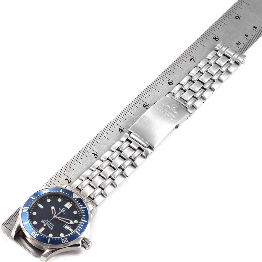 The image shows the Omega Seamaster 2541.80.00 Men
s Stainless Steel Blue Dial 2541.80.00 Men
s Stainless Steel Blue Dial watch laid flat with an attached metal bracelet and a ruler for scale.