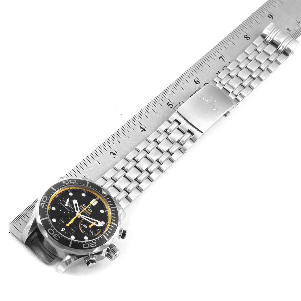 The image shows a side angle of an Omega Seamaster 212.30.44.50.01.002 Men
s Stainless Steel Black Dial 212.30.44.50.01.002 Men
s Stainless Steel Black Dial watch, highlighting its stainless steel bracelet and clasp next to a ruler.