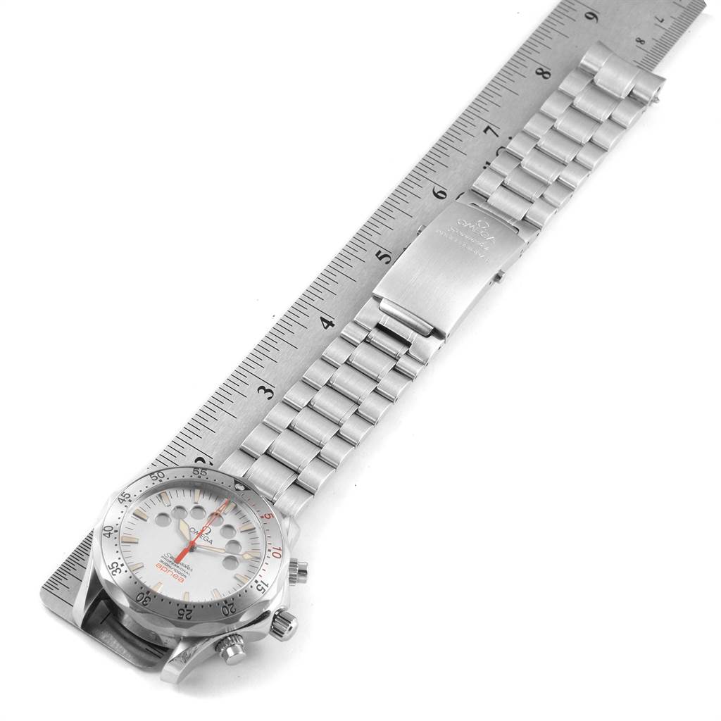 The image shows an Omega Seamaster 2595.30.00 Men
s Stainless Steel Silver Dial 2595.30.00 Men
s Stainless Steel Silver Dial watch laid flat on a ruler, highlighting the watch face, bracelet, and clasp.