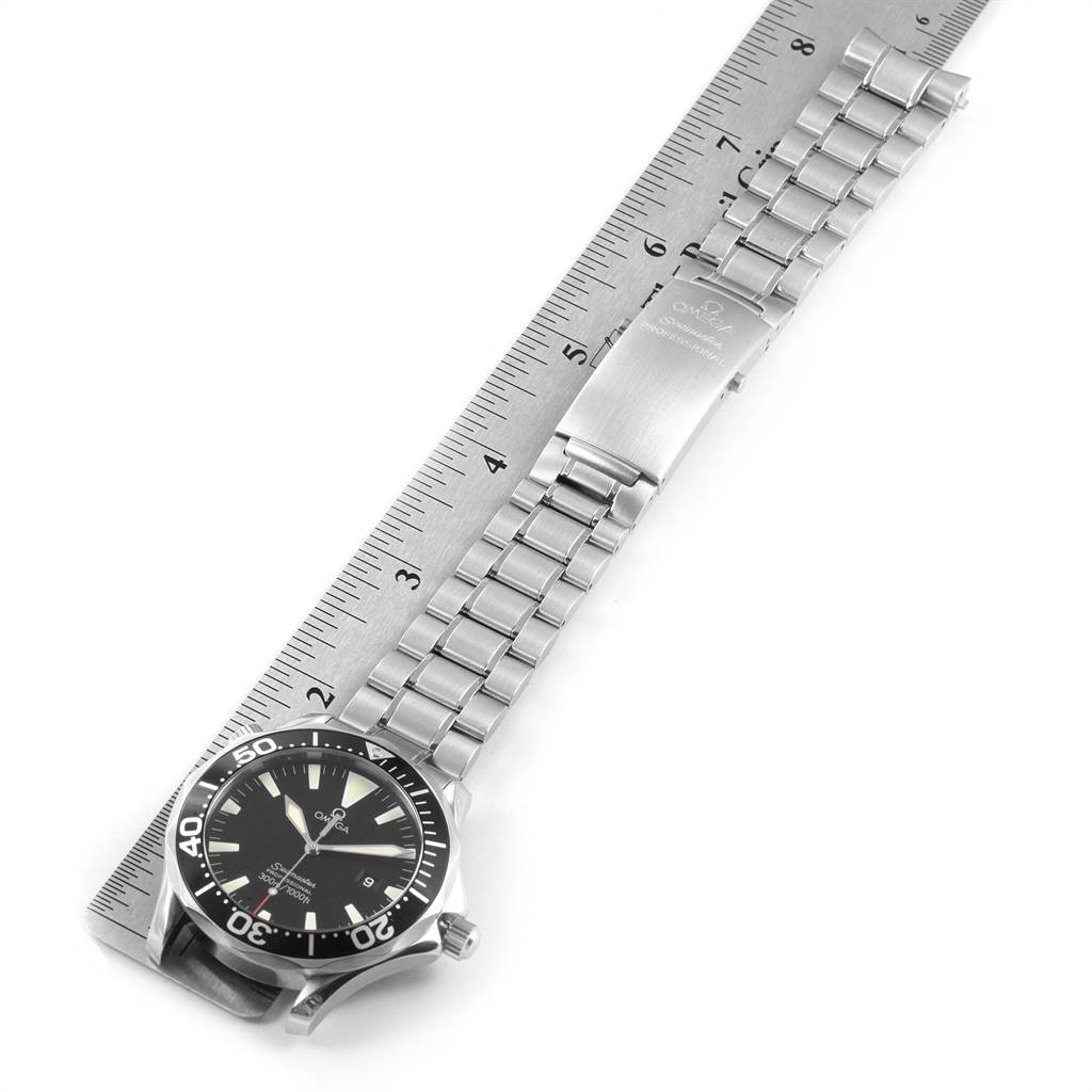 The Omega Seamaster 2264.50.00 Men
s Stainless Steel Black Dial 2264.50.00 Men
s Stainless Steel Black Dial watch is shown from a top view, displaying the face and stainless steel bracelet next to a ruler for scale.