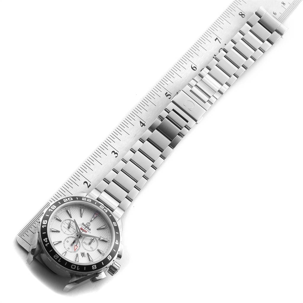 The Omega Seamaster 231.10.44.52.04.001 Men
s Stainless Steel White Dial 231.10.44.52.04.001 Men
s Stainless Steel White Dial watch is shown from an angled top view, featuring the bezel, face, and metal bracelet, with a ruler for scale.