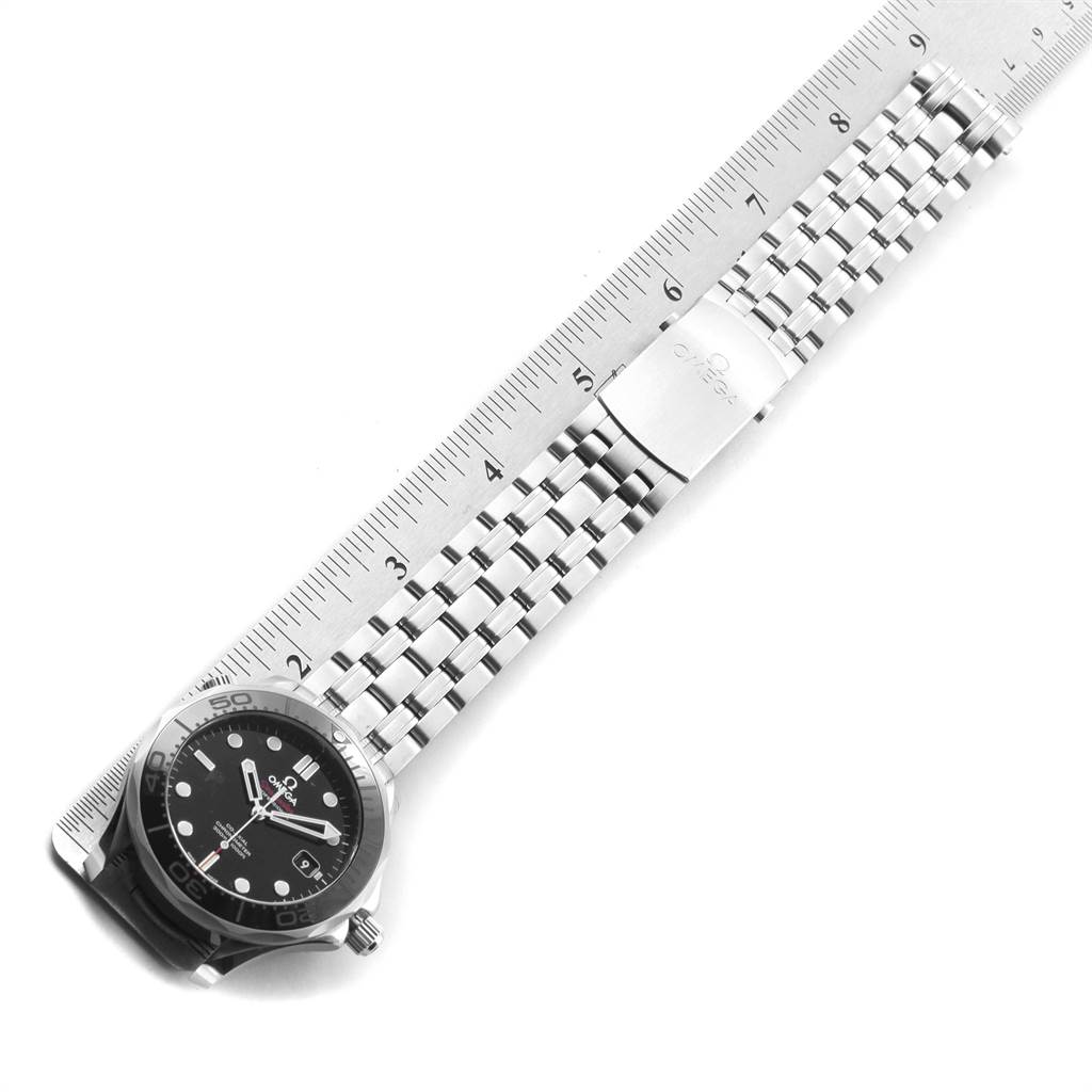 The Omega Seamaster 212.30.41.20.01.003 Men
s Stainless Steel Black Dial 212.30.41.20.01.003 Men
s Stainless Steel Black Dial watch is shown from an overhead angle, highlighting the face, bezel, and stainless steel bracelet next to a ruler for size reference.