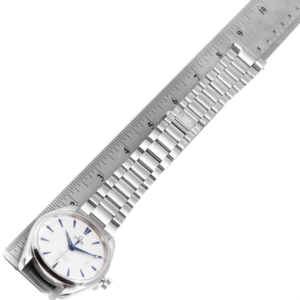 The Omega Seamaster 2502.33.00 Men
s Stainless Steel White Dial 2502.33.00 Men
s Stainless Steel White Dial watch is shown at an angle displaying its face, metal bracelet, and a ruler for size reference.