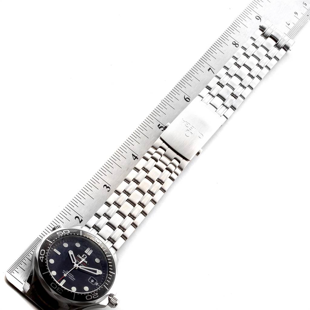 The image shows an Omega Seamaster 212.30.41.20.01.003 Men's Stainless Steel Black Dial 212.30.41.20.01.003 Men's Stainless Steel Black Dial watch laid flat, highlighting its face, bezel, and stainless steel bracelet alongside a ruler.