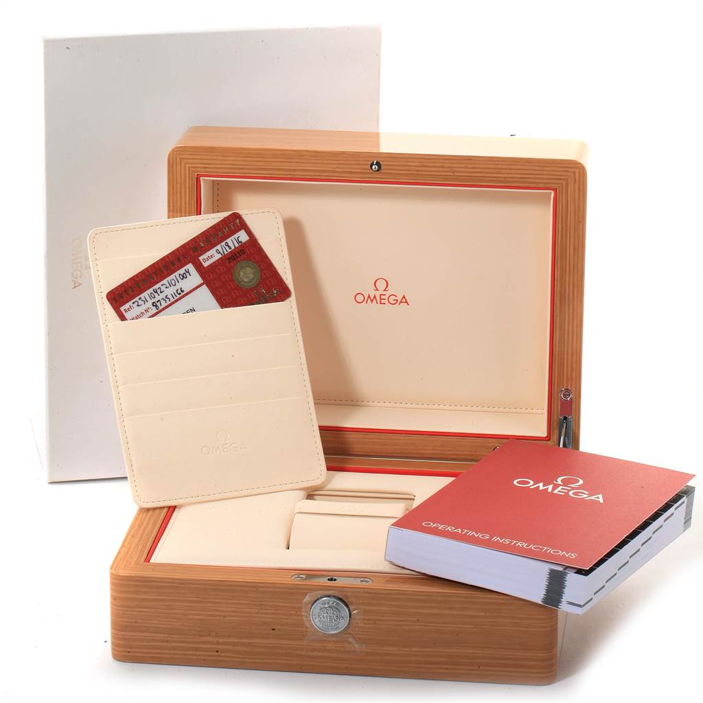 The image shows the packaging and accessories of an Omega Seamaster 231.10.42.21.01.004 Men
s Stainless Steel Black Dial 231.10.42.21.01.004 Men
s Stainless Steel Black Dial, including the box, warranty cards, and manual.