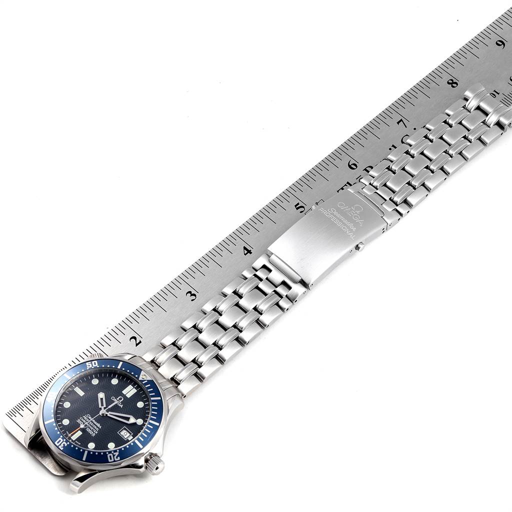The image shows an Omega Seamaster 2531.80.00 Men
s Stainless Steel Blue Dial 2531.80.00 Men
s Stainless Steel Blue Dial watch lying flat with its bracelet stretched alongside a ruler.
