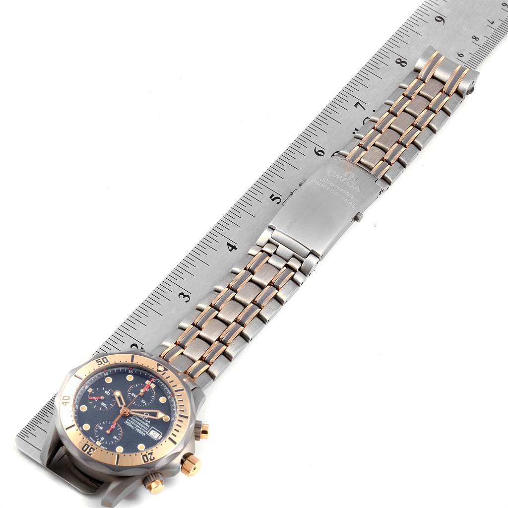 The image shows a full view of an Omega Seamaster 2296.80.00 Men
s Titanium Blue Dial 2296.80.00 Men
s Titanium Blue Dial watch laid flat, with its bracelet and clasp stretched out alongside a ruler.