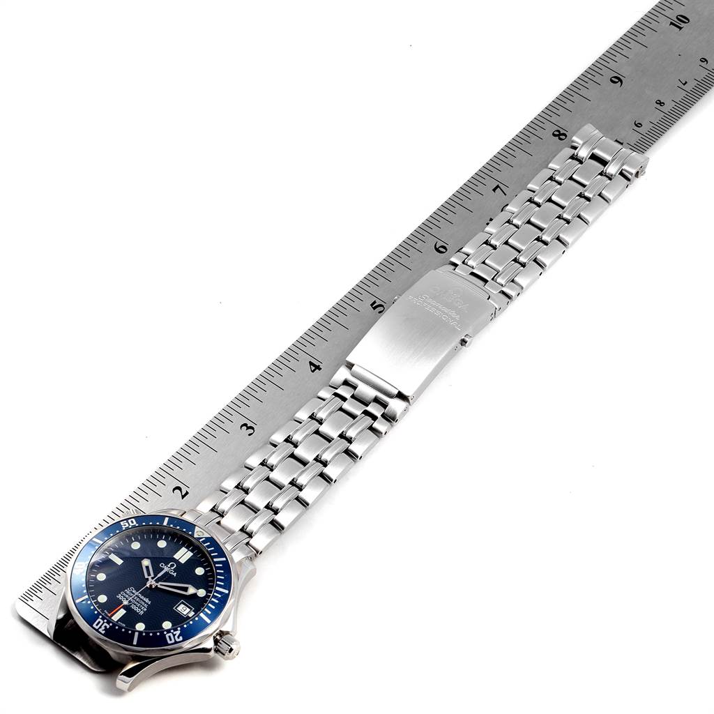 The image shows an Omega Seamaster 2531.80.00 Men
s Stainless Steel Blue Dial 2531.80.00 Men
s Stainless Steel Blue Dial watch at a slight angle, displaying its face, bracelet, and clasp alongside a ruler for scale.