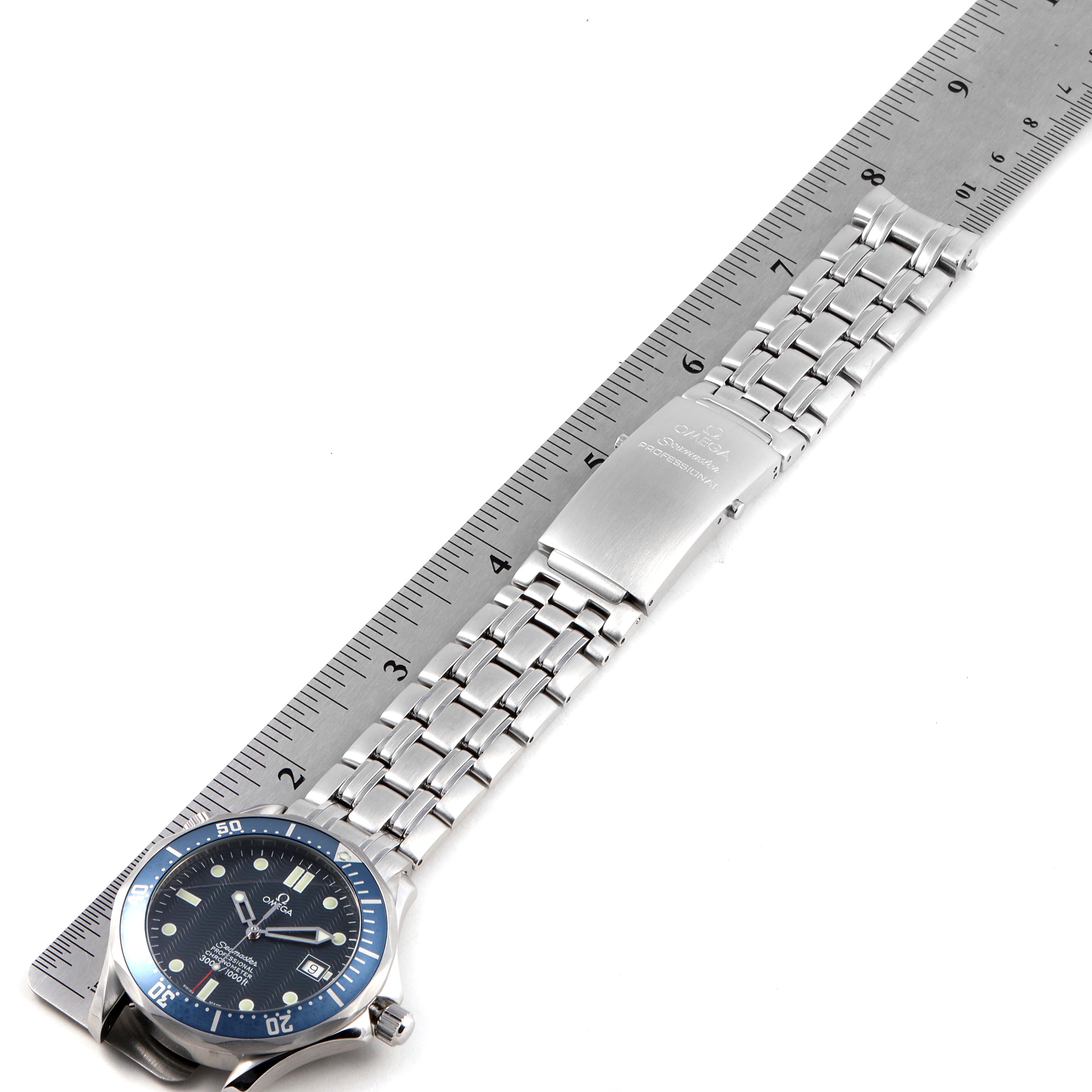 The Omega Seamaster 2531.80.00 Men
s Stainless Steel Blue Dial 2531.80.00 Men
s Stainless Steel Blue Dial watch is shown at a slight angle, displaying the dial, bezel, metal bracelet, and clasp, alongside a ruler for scale.