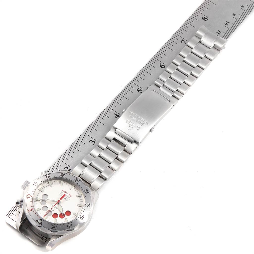 The Omega Seamaster 2595.30.00 Men
s Stainless Steel Silver Dial 2595.30.00 Men
s Stainless Steel Silver Dial watch is shown flat, displaying its white dial, metal bracelet, and clasp, with a ruler beneath for scale.