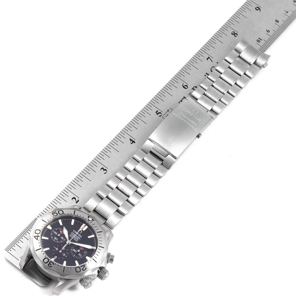 The image shows the Omega Seamaster 2293.52.00 Men's Titanium Black Dial 2293.52.00 Men's Titanium Black Dial watch laying flat with the face and bracelet alongside a ruler for measurement.