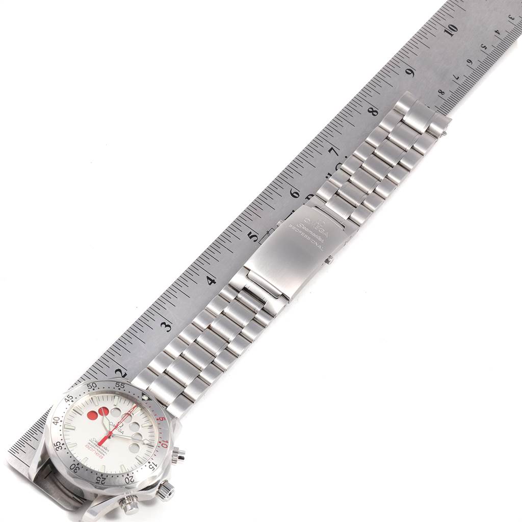 The image shows an overhead view of the Omega Seamaster 2595.30.00 Men
s Stainless Steel Silver Dial 2595.30.00 Men
s Stainless Steel Silver Dial watch with its face, bezel, and stainless steel bracelet measured against a ruler.