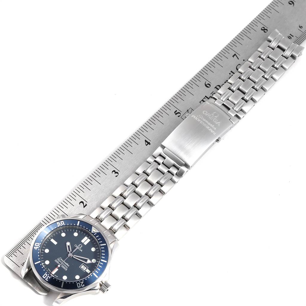 The image shows the Omega Seamaster 2541.80.00 Men
s Stainless Steel Blue Dial 2541.80.00 Men
s Stainless Steel Blue Dial watch laid flat with its bracelet alongside a ruler.