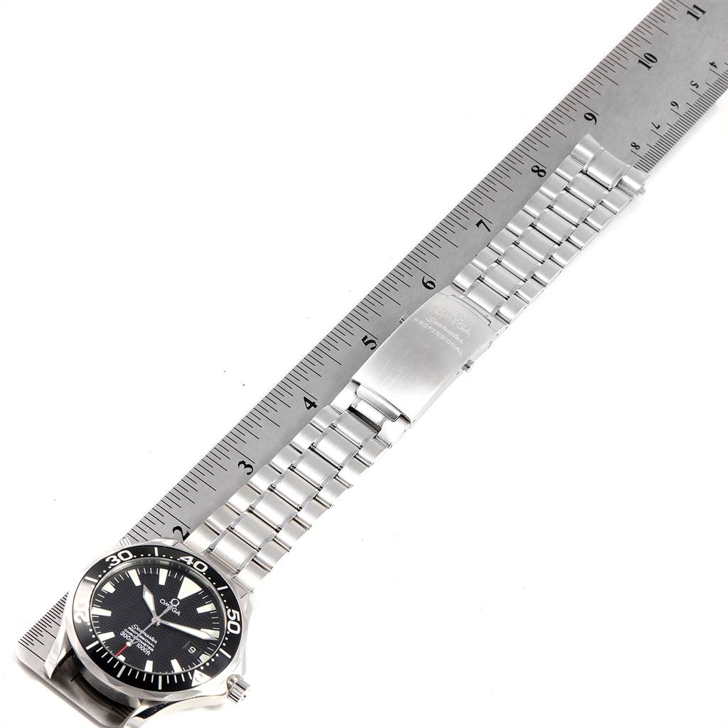 The image shows the Omega Seamaster 2254.50.00 Men
s Stainless Steel Black Dial 2254.50.00 Men
s Stainless Steel Black Dial watch laid flat, with the dial, bezel, and bracelet clearly visible, measured against a ruler.