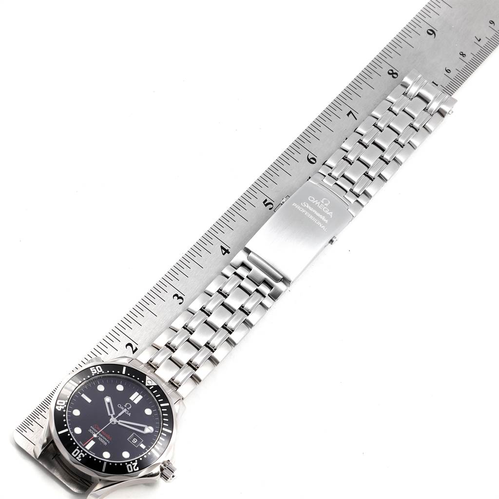 The image shows the Omega Seamaster 212.30.41.61.01.001 Men
s Stainless Steel Black Dial 212.30.41.61.01.001 Men
s Stainless Steel Black Dial watch lying flat with its face, bracelet, and clasp next to a ruler.