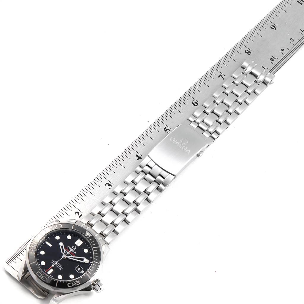 The image shows an Omega Seamaster 212.30.41.20.01.003 Men
s Stainless Steel Black Dial 212.30.41.20.01.003 Men
s Stainless Steel Black Dial watch laid flat with a stainless steel bracelet next to a ruler.