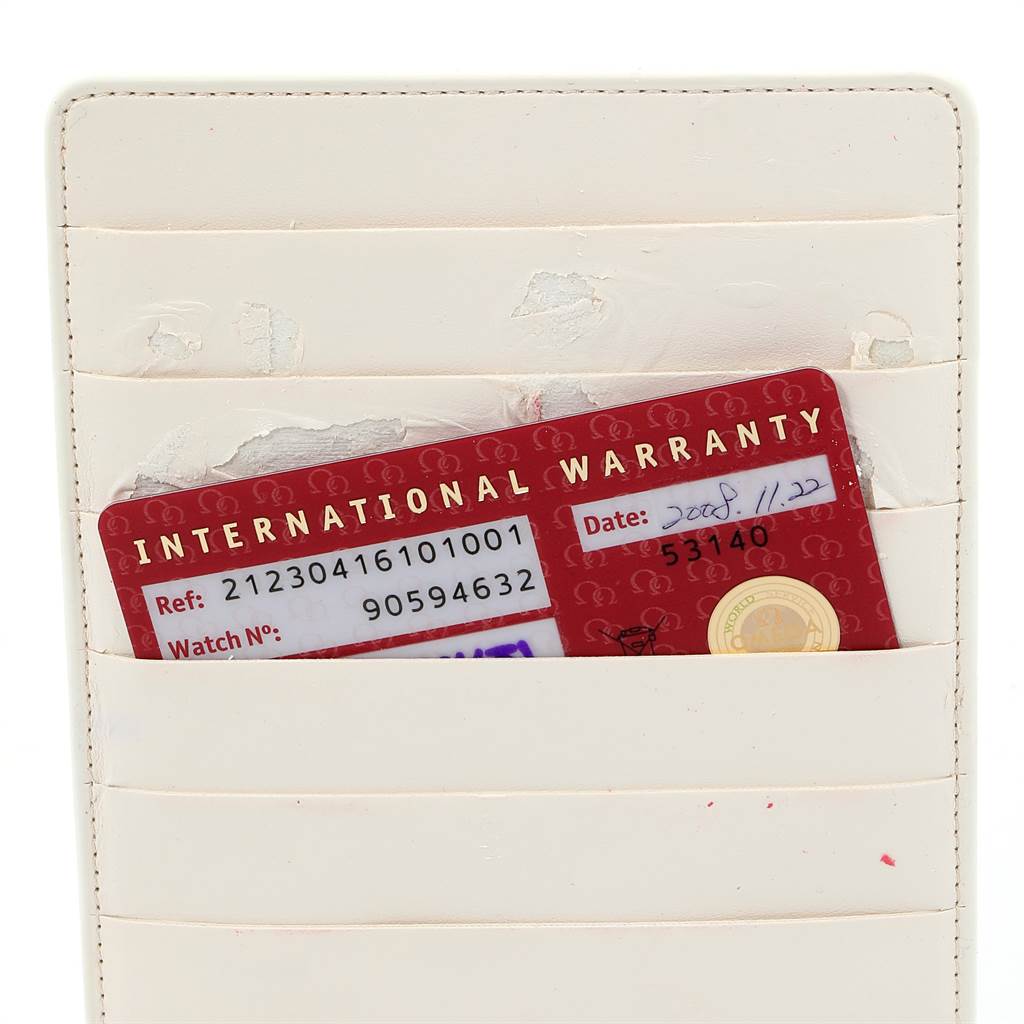 The image shows an International Warranty card for an Omega Seamaster 2221.80.00 Men
s Stainless Steel Blue Dial 2221.80.00 Men
s Stainless Steel Blue Dial watch inside a cream-colored card holder.