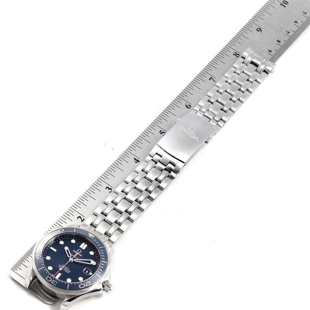 The image shows an Omega Seamaster 212.30.41.20.03.001 Men
s Stainless Steel Blue Dial 212.30.41.20.03.001 Men
s Stainless Steel Blue Dial watch laid flat with a metal bracelet next to a ruler for measurement.