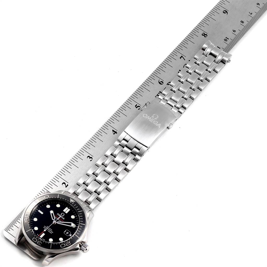 The image shows an Omega Seamaster 212.30.41.20.01.003 Men
s Stainless Steel Black Dial 212.30.41.20.01.003 Men
s Stainless Steel Black Dial watch placed beside a ruler with its face, bracelet, and clasp visible.