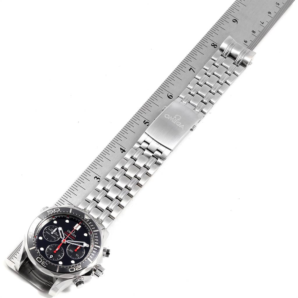 The image shows an Omega Seamaster 212.30.44.50.01.001 Men
s Stainless Steel Black Dial 212.30.44.50.01.001 Men
s Stainless Steel Black Dial watch with a metal bracelet, aligned with a ruler for measurement.