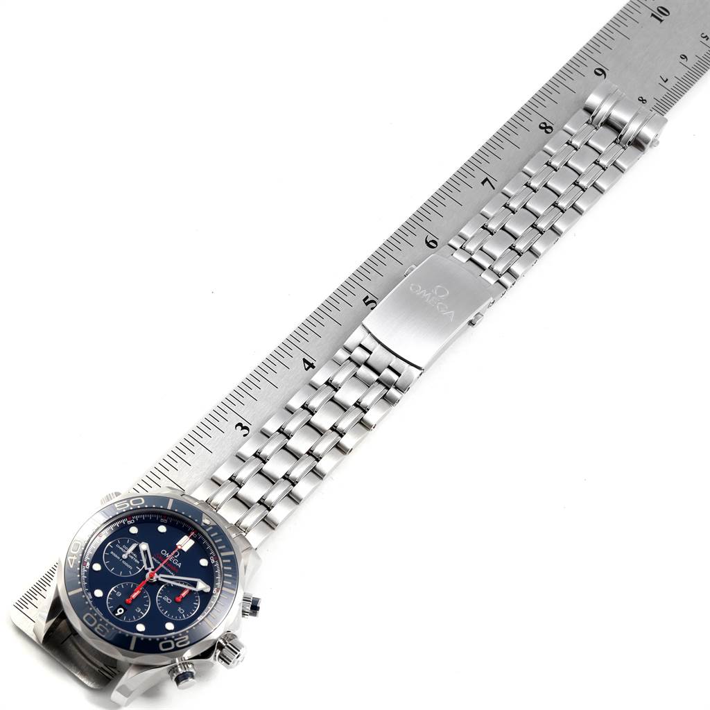 The image shows an Omega Seamaster 212.30.44.50.03.001 Men
s Stainless Steel Blue Dial 212.30.44.50.03.001 Men
s Stainless Steel Blue Dial watch laid flat with a metal bracelet and a ruler for scale.