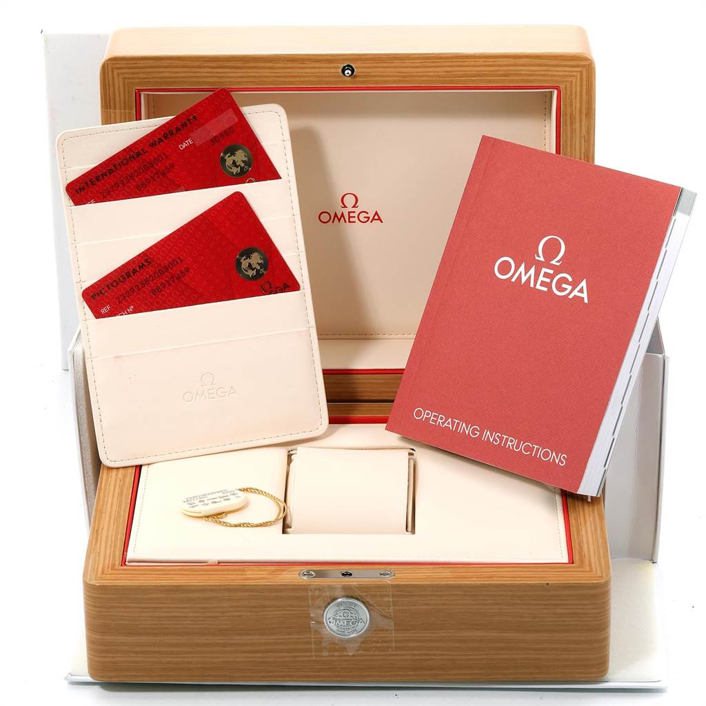 The image shows the accessories such as the warranty cards, instruction manual, and display box for the Omega Seamaster 232.92.38.20.03.001 Titanium Blue Dial 232.92.38.20.03.001 Titanium Blue Dial watch.