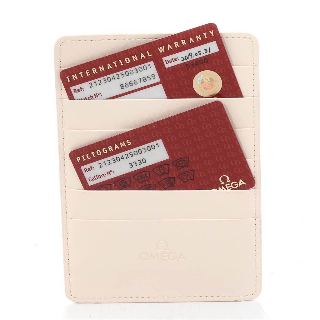 The image shows Omega Seamaster 212.30.42.50.03.001 Men
s Stainless Steel Blue Dial 212.30.42.50.03.001 Men
s Stainless Steel Blue Dial International Warranty and Pictograms cards in a cream-colored cardholder.