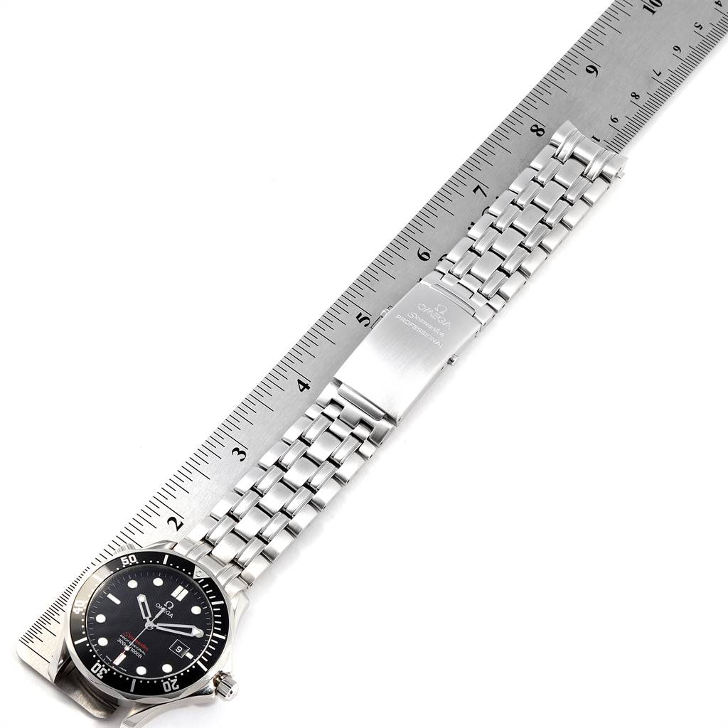 The image shows an Omega Seamaster 212.30.41.61.01.001 Men
s Stainless Steel Black Dial 212.30.41.61.01.001 Men
s Stainless Steel Black Dial watch laid flat next to a ruler, displaying the face and stainless steel bracelet.