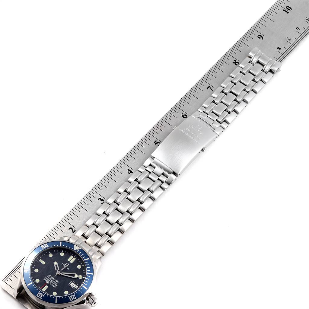 The image shows an Omega Seamaster 2531.80.00 Men
s Stainless Steel Blue Dial 2531.80.00 Men
s Stainless Steel Blue Dial watch laid flat next to a ruler, displaying its dial, bezel, bracelet, and clasp.