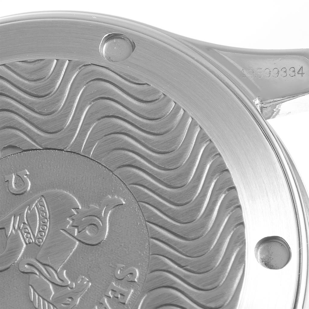 This image shows a close-up of the case back of an Omega Seamaster 2551.80.00 Men
s Stainless Steel Blue Dial 2551.80.00 Men
s Stainless Steel Blue Dial watch, highlighting its wave pattern and engravings.