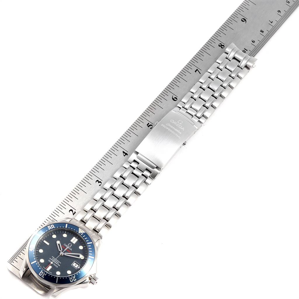 The Omega Seamaster 2220.80.00 Men
s Stainless Steel Blue Dial 2220.80.00 Men
s Stainless Steel Blue Dial watch is shown laid flat with its stainless steel bracelet and clasp visible against a ruler for size reference.