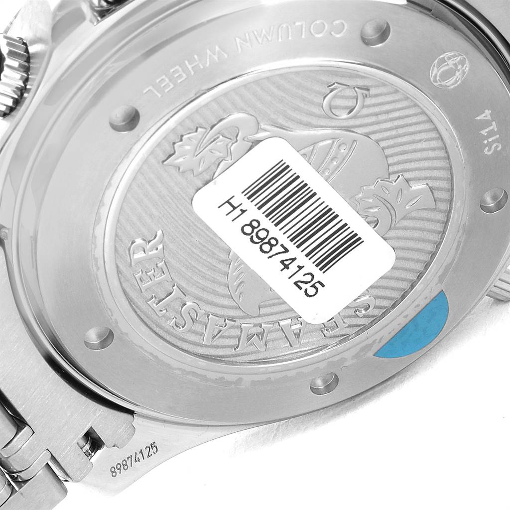 The image shows the back of the Omega Seamaster 212.30.44.50.01.002 Men
s Stainless Steel Black Dial 212.30.44.50.01.002 Men
s Stainless Steel Black Dial watch, highlighting the emblem and serial number with a visible barcode sticker.