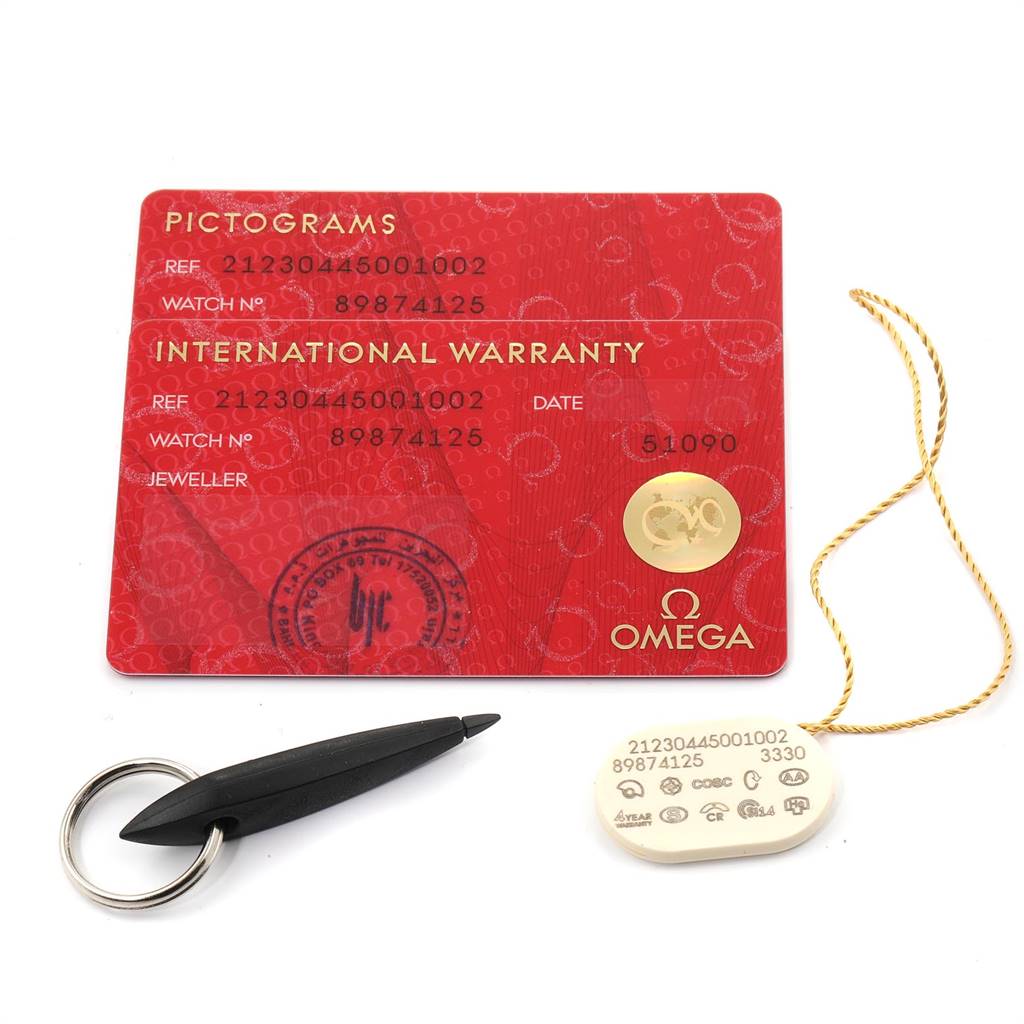 The image shows the international warranty and pictogram cards for the Omega Seamaster 212.30.44.50.01.002 Men
s Stainless Steel Black Dial 212.30.44.50.01.002 Men
s Stainless Steel Black Dial watch along with a tag and a keychain tool.