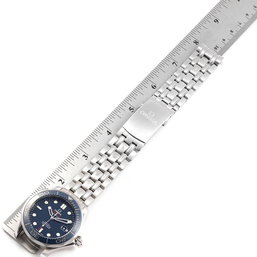 The Omega Seamaster 212.30.41.20.03.001 Men
s Stainless Steel Blue Dial 212.30.41.20.03.001 Men
s Stainless Steel Blue Dial watch is shown from a top view, displaying the face, bracelet, and clasp next to a ruler.