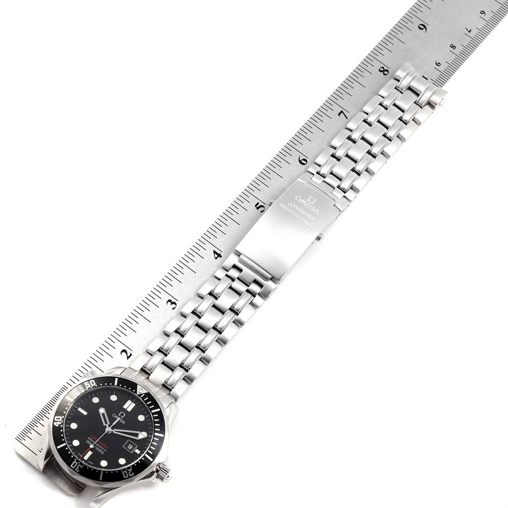 The image shows an Omega Seamaster 212.30.41.61.01.001 Men
s Stainless Steel Black Dial 212.30.41.61.01.001 Men
s Stainless Steel Black Dial watch laid flat, emphasizing the watch face, bracelet, and clasp on a ruler for measurement.