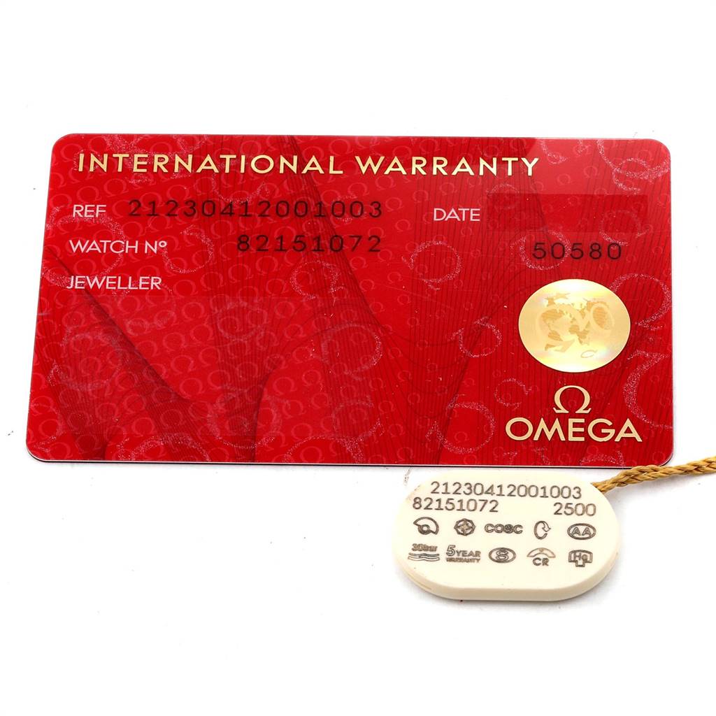 The image shows an Omega International Warranty card and a tag for the Seamaster model.
